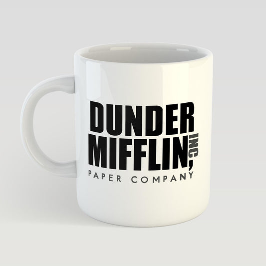 White mug with 'Dunder Mifflin, Inc. Paper Company' text on a light gray background