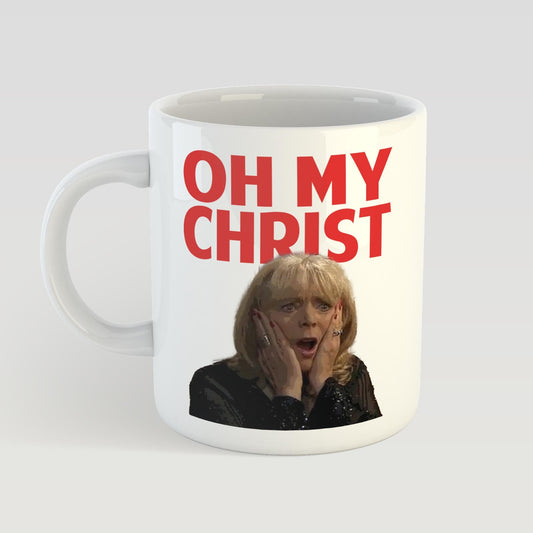 White mug with 'OH MY CHRIST' text and a person's face on a light gray background
