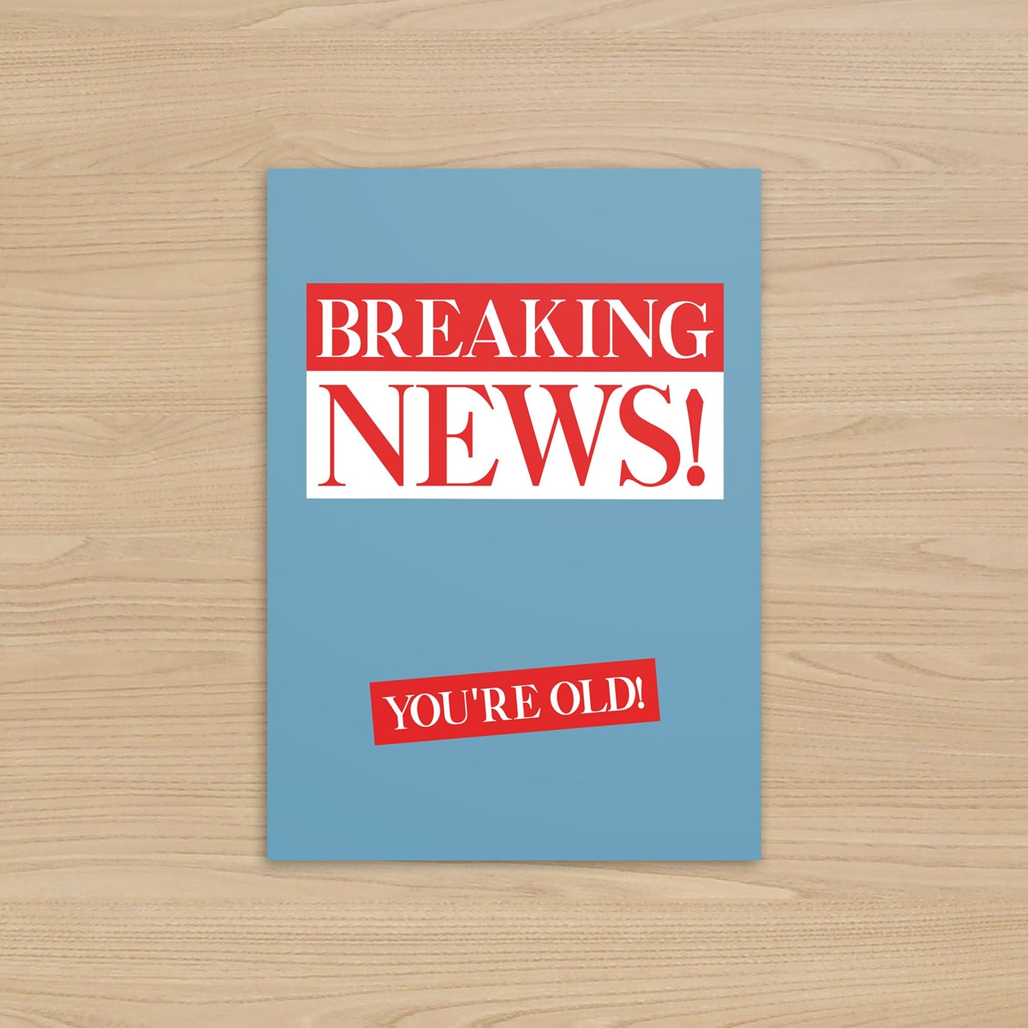 Card with 'Breaking News! You're Old!' text on a blue background