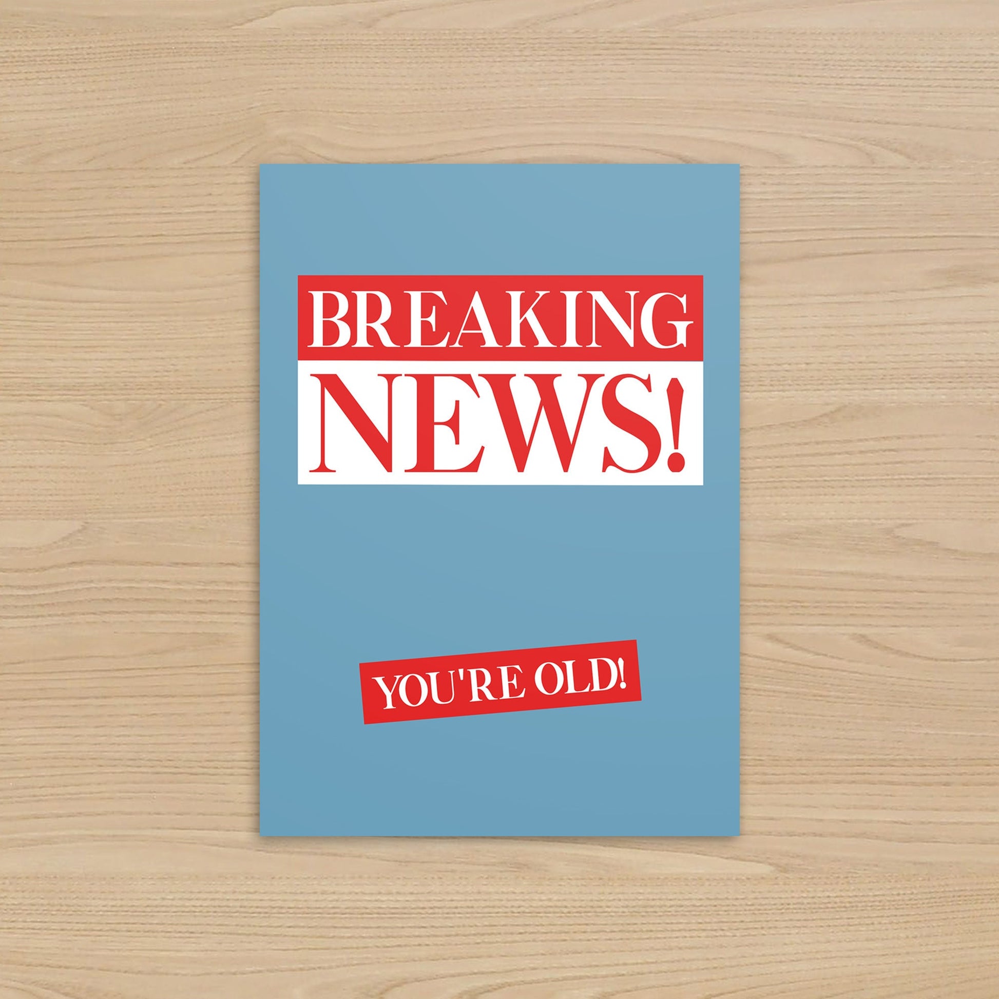 Card with 'Breaking News! You're Old!' text on a blue background