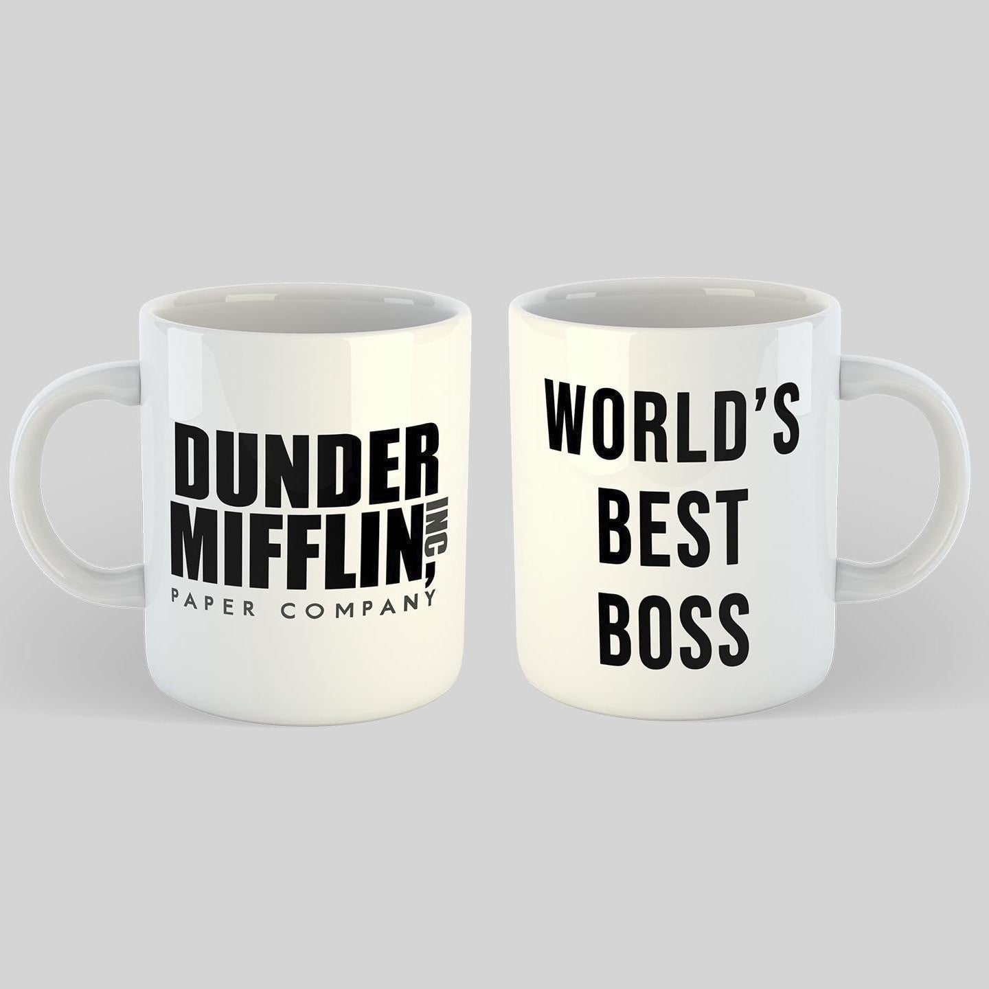 Two white mugs with text on a light gray background