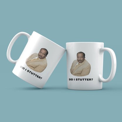 Two white mugs with a printed image and text on a light blue background