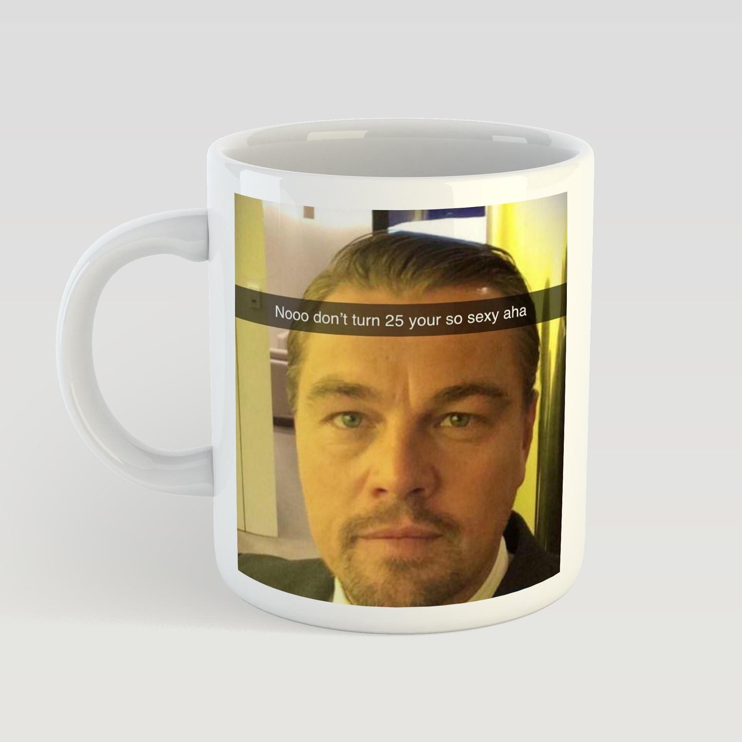 Mug with a printed design of a man's face and text on a white background