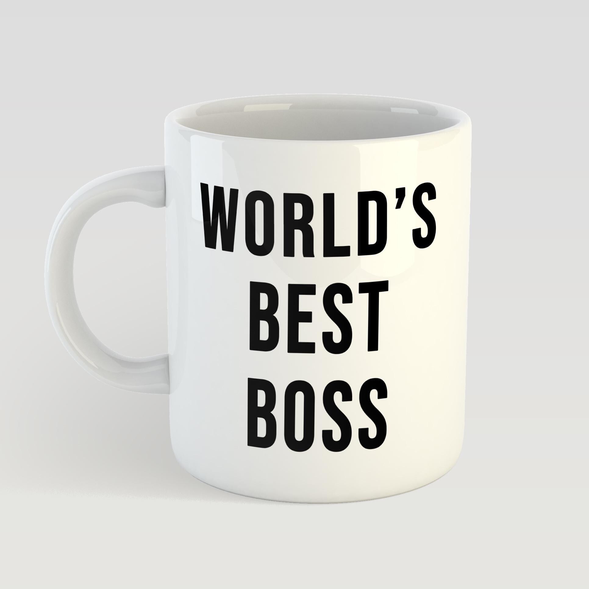 White mug with 'World's Best Boss' text on a light gray background