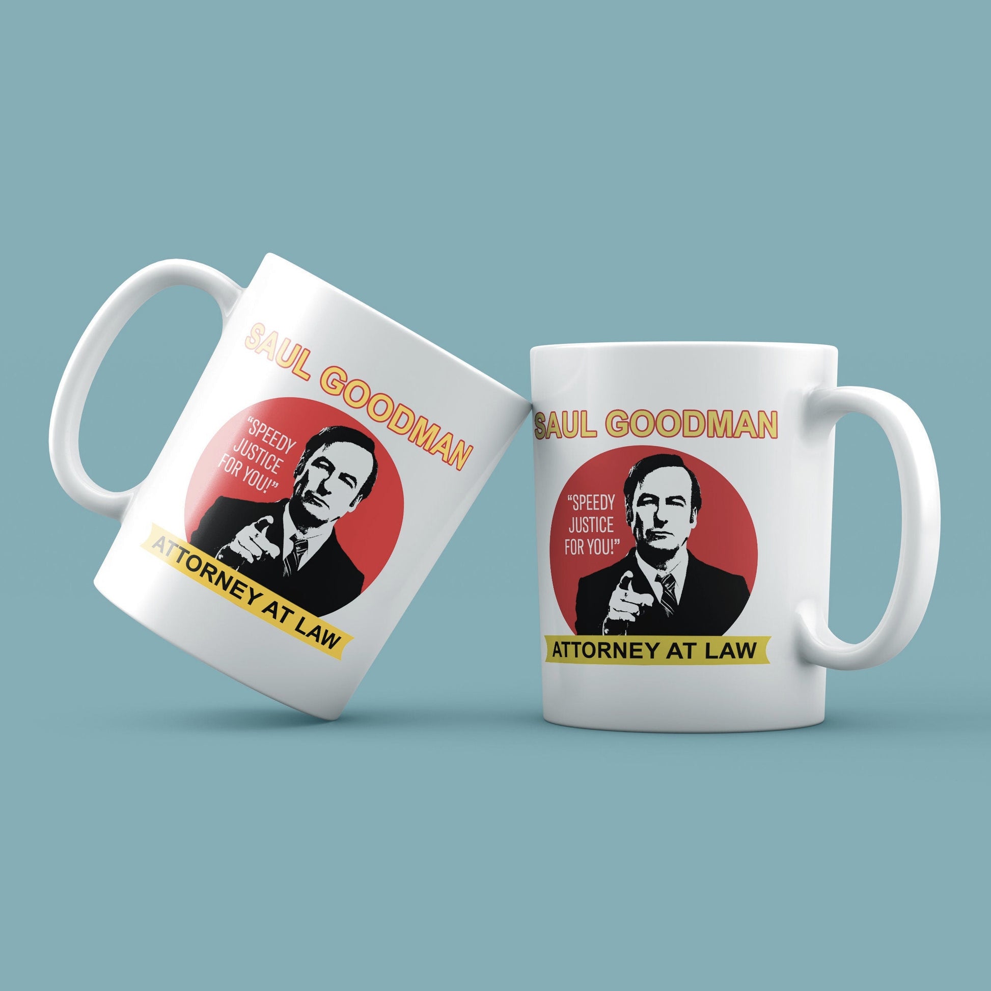 Two white mugs with a graphic of a man labelled 'Saul Goodman, Attorney at Law' on a light blue background.