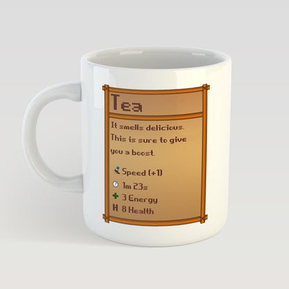 White mug with a Stardew Valley tea-themed graphic on a light gray background